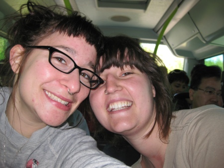 me and chelsea, posing on the bus. pretend like you can't see my arm (how embarrassing).